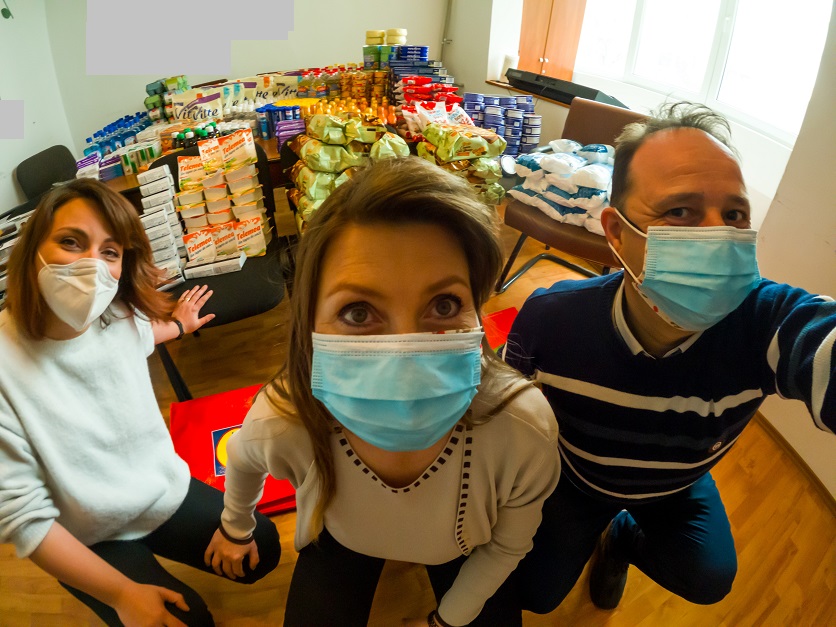 Simona, Flori and Ovidiu preparing Easter parcels of foods and medicines at the HQ